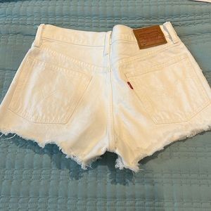Levi’s white denim shorts.